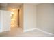 Bedroom doorway leading into bathroom with carpeted floor, neutral colored walls, and closet space at 300 W 5Th St # 404, Charlotte, NC 28202