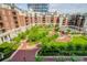 Beautiful courtyard with lush landscaping, walkways, and amenities in a luxury condo community at 300 W 5Th St # 404, Charlotte, NC 28202