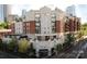 Stunning luxury condo building with brick facade and balconies in a vibrant urban setting at 300 W 5Th St # 404, Charlotte, NC 28202