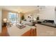 Bright living room with hardwood floors, comfortable seating, and balcony access at 300 W 5Th St # 404, Charlotte, NC 28202