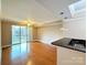 Bright living area with hardwood floors, balcony access, and open layout at 300 W 5Th St # 404, Charlotte, NC 28202