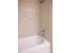 Close up of tiled shower and tub, featuring a shower head and white tub at 300 W 5Th St # 404, Charlotte, NC 28202