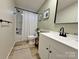 Well-lit bathroom with shower, modern vanity, and white fixtures at 3154 Loomis St, Lincolnton, NC 28092