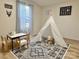 Playful bedroom with a teepee, table, and chairs, designed for fun and creativity at 3154 Loomis St, Lincolnton, NC 28092