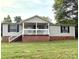 Charming single-story home with a inviting front porch and well-maintained lawn at 3154 Loomis St, Lincolnton, NC 28092