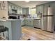 Modern kitchen with stylish blue cabinets, stainless steel appliances, and bar seating at 3154 Loomis St, Lincolnton, NC 28092