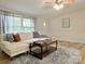 Cozy living room featuring a plush sofa, decorative rug, and ample natural light at 3154 Loomis St, Lincolnton, NC 28092