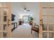 Bright bonus room with ceiling fan as viewed through french doors, perfect for a home office or flex space at 3304 Danhill Pl, Matthews, NC 28105
