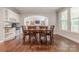 Cozy breakfast area with hardwood floors, ample seating, and access to the living spaces at 3304 Danhill Pl, Matthews, NC 28105