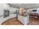 Well-appointed kitchen featuring a central island, white cabinetry, stainless steel appliances, and open design at 3304 Danhill Pl, Matthews, NC 28105