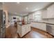 Open kitchen showcases a center island, stainless appliances, white cabinetry, and easy access to other living areas at 3304 Danhill Pl, Matthews, NC 28105