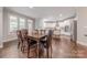 Spacious kitchen with white cabinets, stainless steel appliances, and hardwood floors and a breakfast area at 3304 Danhill Pl, Matthews, NC 28105
