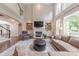 Bright living room featuring fireplace, built-in shelving, and comfortable seating at 3304 Danhill Pl, Matthews, NC 28105