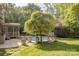 Beautiful backyard features a screened in porch, patio, pristine in-ground pool and beautifully landscaped yard at 3304 Danhill Pl, Matthews, NC 28105