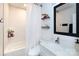 Bathroom featuring white hexagon tile, a shower with curtain, a modern toilet and a floating vanity at 3307 Draper Ave, Charlotte, NC 28205