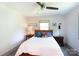 Cozy bedroom featuring a full sized bed and a nightstand with lamp at 3307 Draper Ave, Charlotte, NC 28205