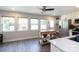 Spacious kitchen featuring stainless steel appliances, white cabinetry, and light-filled windows at 3307 Draper Ave, Charlotte, NC 28205