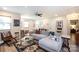 Comfortable living room with neutral walls, ceiling fan, and stylish decor with a modern sofa at 3307 Draper Ave, Charlotte, NC 28205