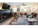 Comfortable living room featuring a brick fireplace, stylish furnishings, and ample natural light at 3307 Draper Ave, Charlotte, NC 28205