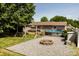 This backyard features a fire pit, swimming pool, swing set, and outdoor furniture, creating a relaxing and entertaining space at 3310 46Th Ne Ave, Hickory, NC 28601