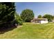 Spacious backyard featuring a play area and mature trees at 3310 46Th Ne Ave, Hickory, NC 28601