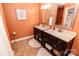 Bathroom with double sinks, decorative mirrors, and ample counter space at 3310 46Th Ne Ave, Hickory, NC 28601