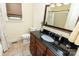 Bathroom showcasing dark vanity with granite counter, tile floor, and shower/tub combo at 3310 46Th Ne Ave, Hickory, NC 28601