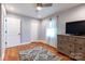 Bedroom featuring hardwood floors, large window, closet, and dresser at 3310 46Th Ne Ave, Hickory, NC 28601