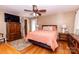 Comfortable bedroom features hardwood floors, ceiling fan, and stylish furnishings, creating a relaxing retreat at 3310 46Th Ne Ave, Hickory, NC 28601