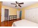 Bedroom with hardwood floors, ample closet space, a ceiling fan, and an ensuite bathroom at 3310 46Th Ne Ave, Hickory, NC 28601