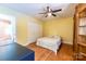 Bedroom featuring hardwood floors, a ceiling fan, generous closet space and natural light at 3310 46Th Ne Ave, Hickory, NC 28601