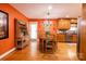 Bright dining area with hardwood floors, a round table with seating for six, and adjacent kitchen at 3310 46Th Ne Ave, Hickory, NC 28601