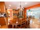 Open-concept dining area with hardwood floors, a classic chandelier, and access to the living room at 3310 46Th Ne Ave, Hickory, NC 28601