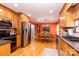 Bright kitchen featuring stainless steel appliances, wood cabinets, and view to a dining area at 3310 46Th Ne Ave, Hickory, NC 28601