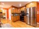 Spacious kitchen featuring stainless steel appliances, wooden cabinetry, and warm lighting at 3310 46Th Ne Ave, Hickory, NC 28601