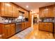 Well-lit kitchen with wooden cabinets, stainless steel appliances, and a view into the pantry at 3310 46Th Ne Ave, Hickory, NC 28601