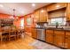 Kitchen and dining area featuring wood cabinets, stainless appliances, and cozy dining set at 3310 46Th Ne Ave, Hickory, NC 28601
