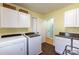 Bright laundry room with white appliances and cabinets at 3310 46Th Ne Ave, Hickory, NC 28601