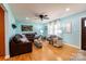 Bright living room with hardwood floors, a ceiling fan, and a comfortable seating area with large windows at 3310 46Th Ne Ave, Hickory, NC 28601
