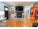 Bright, open living room with hardwood floors, fireplace, and seamless flow to other living spaces at 3310 46Th Ne Ave, Hickory, NC 28601