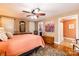 Comfortable main bedroom featuring a ceiling fan, artwork, and ensuite bathroom at 3310 46Th Ne Ave, Hickory, NC 28601