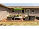 A cozy outdoor patio features comfortable seating, a table with an umbrella, perfect for relaxing or entertaining guests at 3310 46Th Ne Ave, Hickory, NC 28601