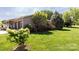 Landscaped yard with flowering dogwood in the foreground at 3310 46Th Ne Ave, Hickory, NC 28601