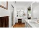 Bright bathroom with a vanity area featuring a marble countertop, with a built in seating area and plenty of storage at 3424 Clydesdale Dr, Gastonia, NC 28056