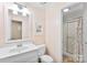 Cozy bathroom featuring peach walls, a white vanity, and a shower/tub combo at 3424 Clydesdale Dr, Gastonia, NC 28056