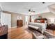 Bedroom with wood floors, neutral walls, a ceiling fan, and furnishings for rest and relaxation at 3424 Clydesdale Dr, Gastonia, NC 28056