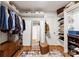 Walk-in closet with built-in shelving, a mirror, and ample storage space for clothes and accessories at 3424 Clydesdale Dr, Gastonia, NC 28056