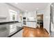 Classic kitchen with hardwood floors, white cabinets, granite countertops, and stainless steel appliances at 3424 Clydesdale Dr, Gastonia, NC 28056