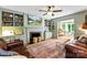 Cozy living room features built-in shelves, a fireplace, and access to a sunroom at 3424 Clydesdale Dr, Gastonia, NC 28056