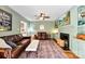 Living room features built-in shelves, a fireplace, a ceiling fan, and a large rug at 3424 Clydesdale Dr, Gastonia, NC 28056